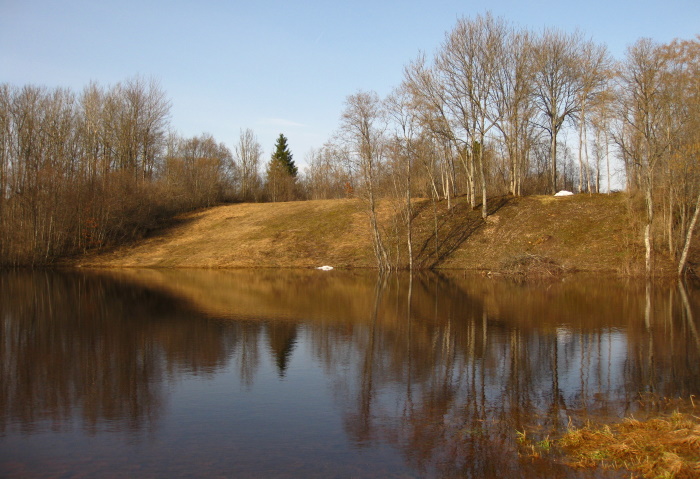 The same place as in the previous picture, but the seemingly flat area is flooded with water.  